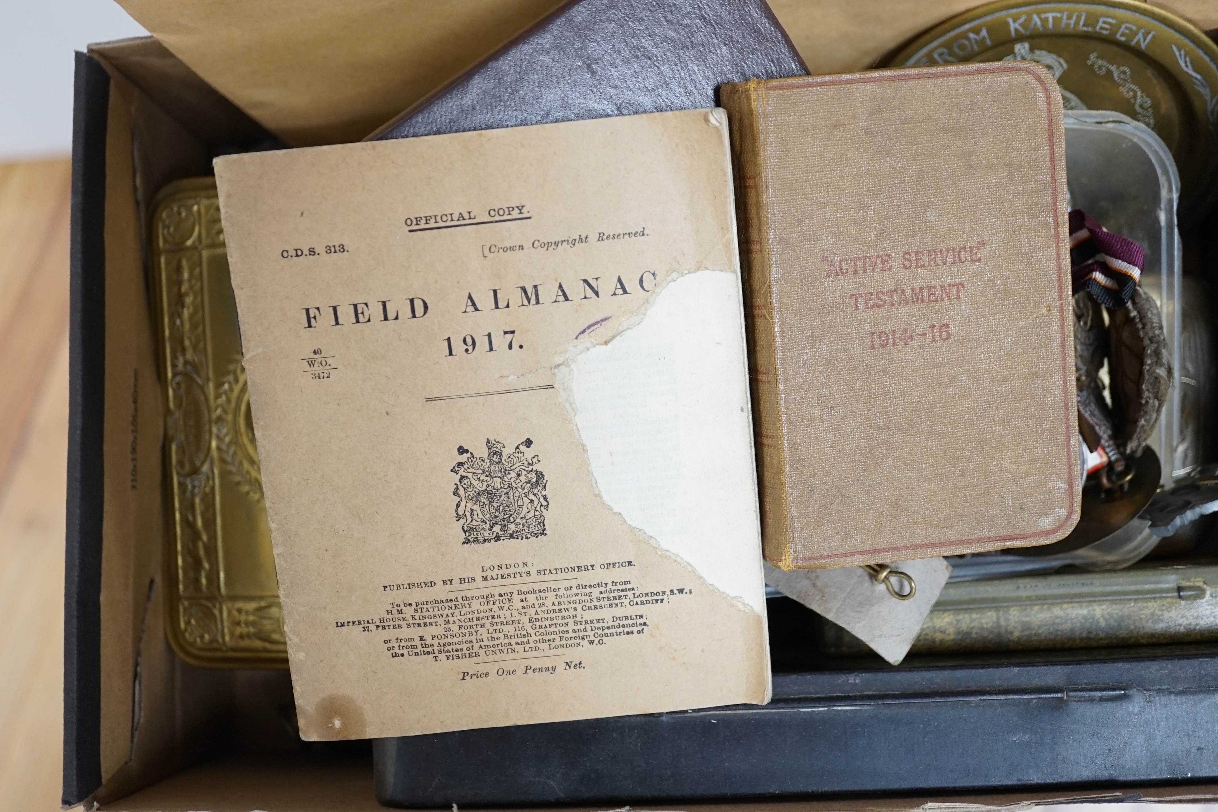 Two WWI medals, collection of cap badges and buttons, Queen Mary tobacco tin and a 66th Infantry Brigade concert party clickety clack cigarette case etc